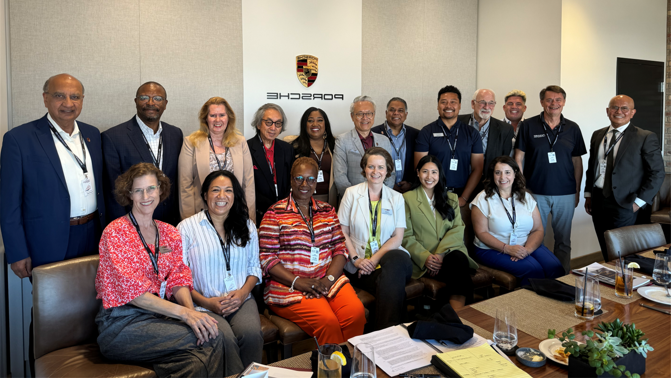 board members standing and sitting together